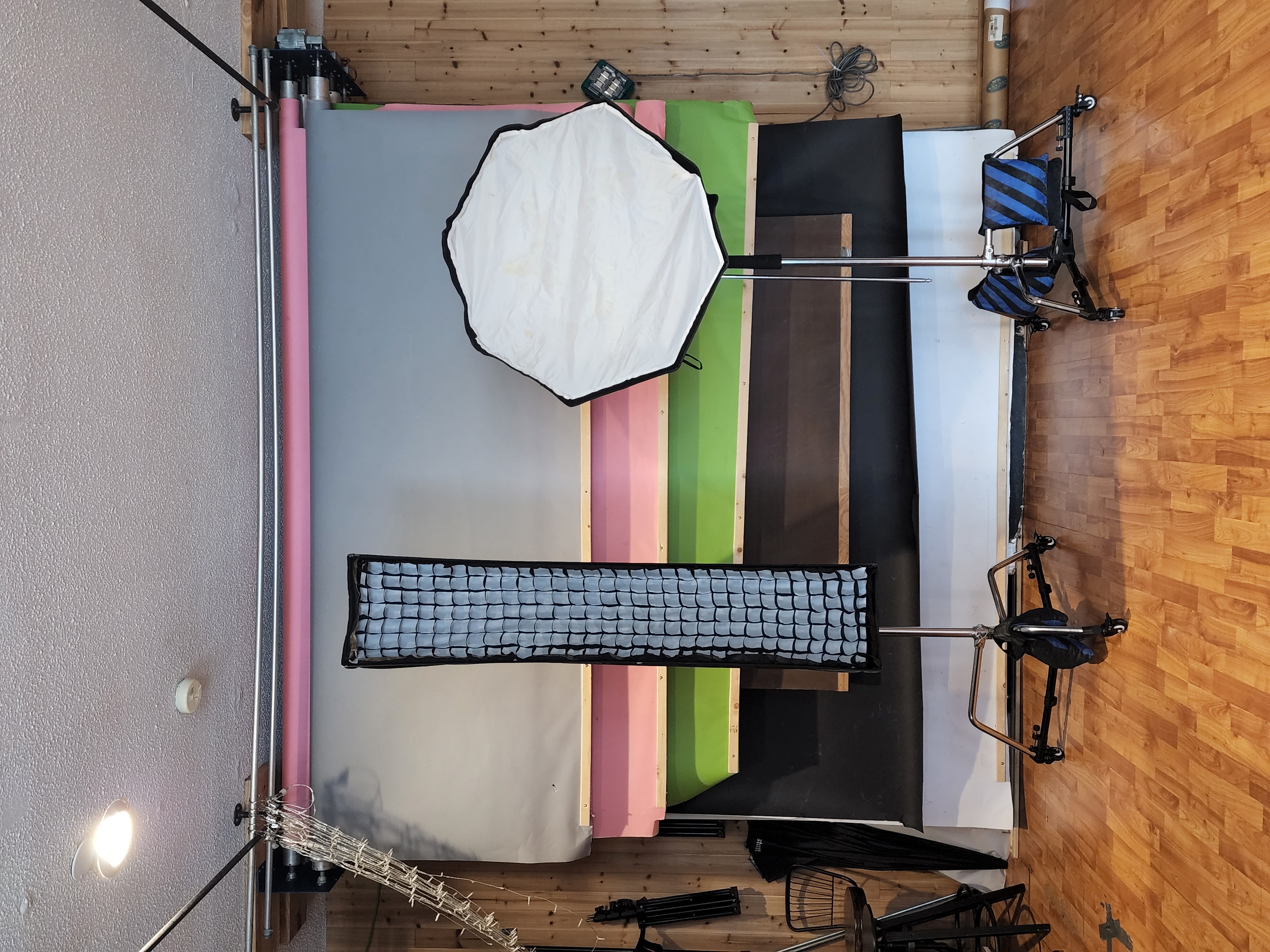 Motorized 5-roll seamless paper backdrop system in earth and neutral studio tones