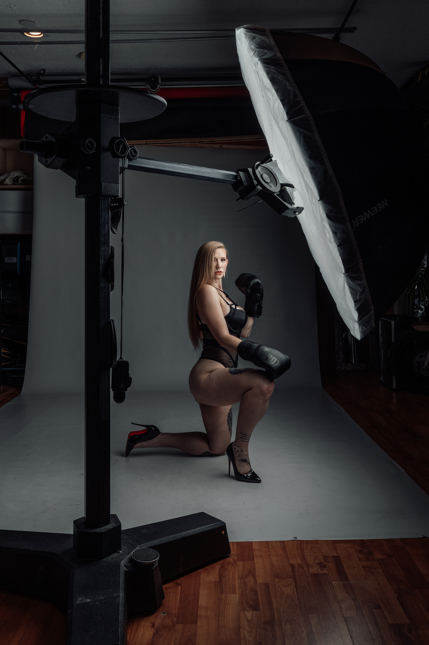 Wide view of photography shooting bay with white seamless paper and natural light