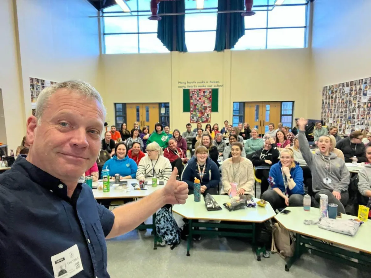 Dean Cotton, Behaviour Smart CEO, taking a group photo with teachers, school staff, and school leaders during a behaviour management training session, supporting UK schools and children’s homes with expert-led strategies.
