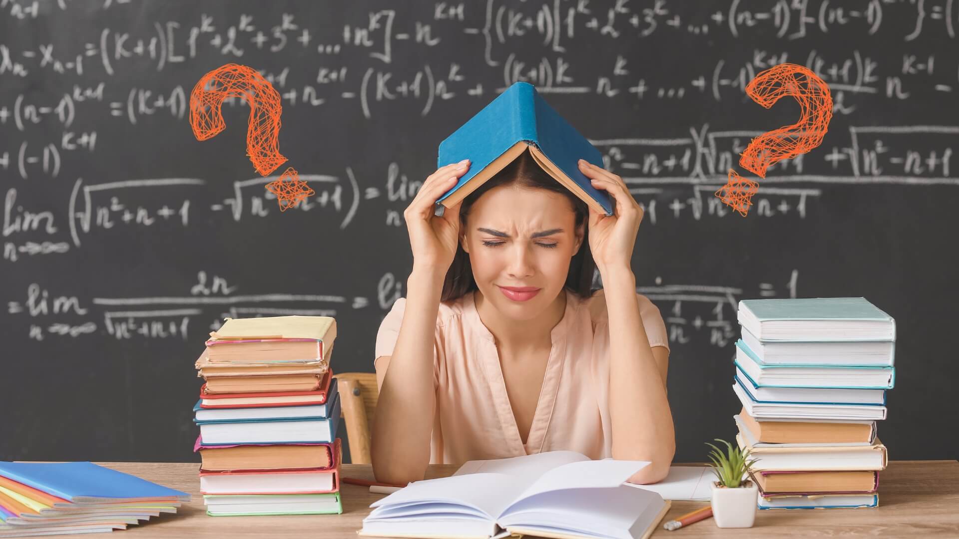 Stressed teacher at classroom desk holding book on her head with question marks overhead — illustrating common behaviour management challenges faced by schools