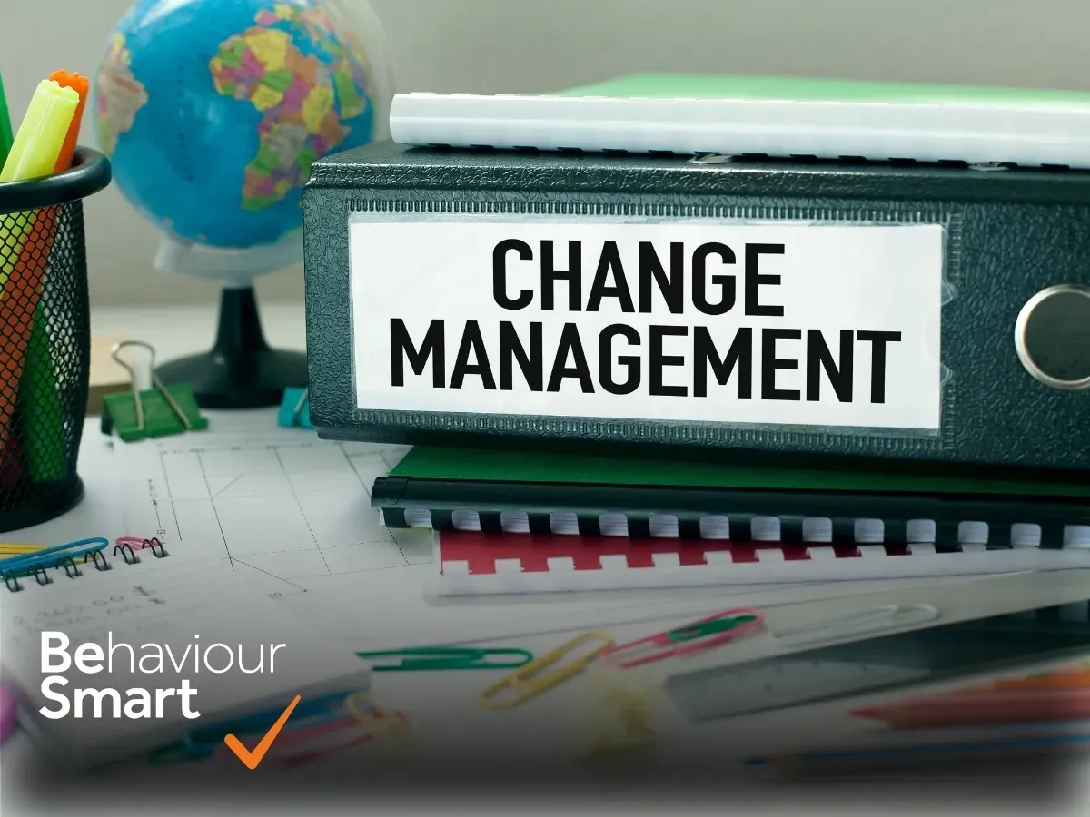 Lever arch file labelled Change Management on a school desk with the Behaviour Smart logo, representing supported MIS change management for schools