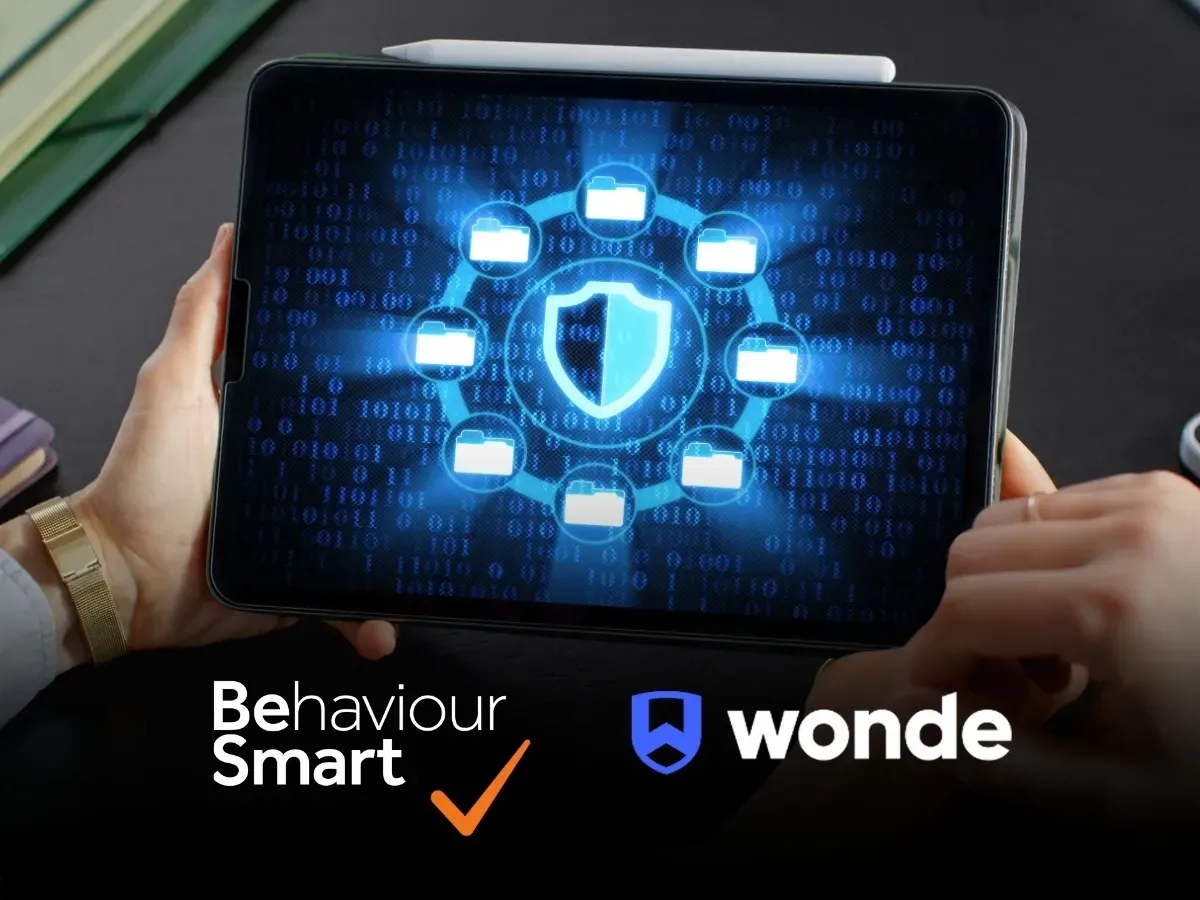 Tablet screen showing a digital security shield and folders with Behaviour Smart and Wonde logos, highlighting secure MIS data integration for schools
