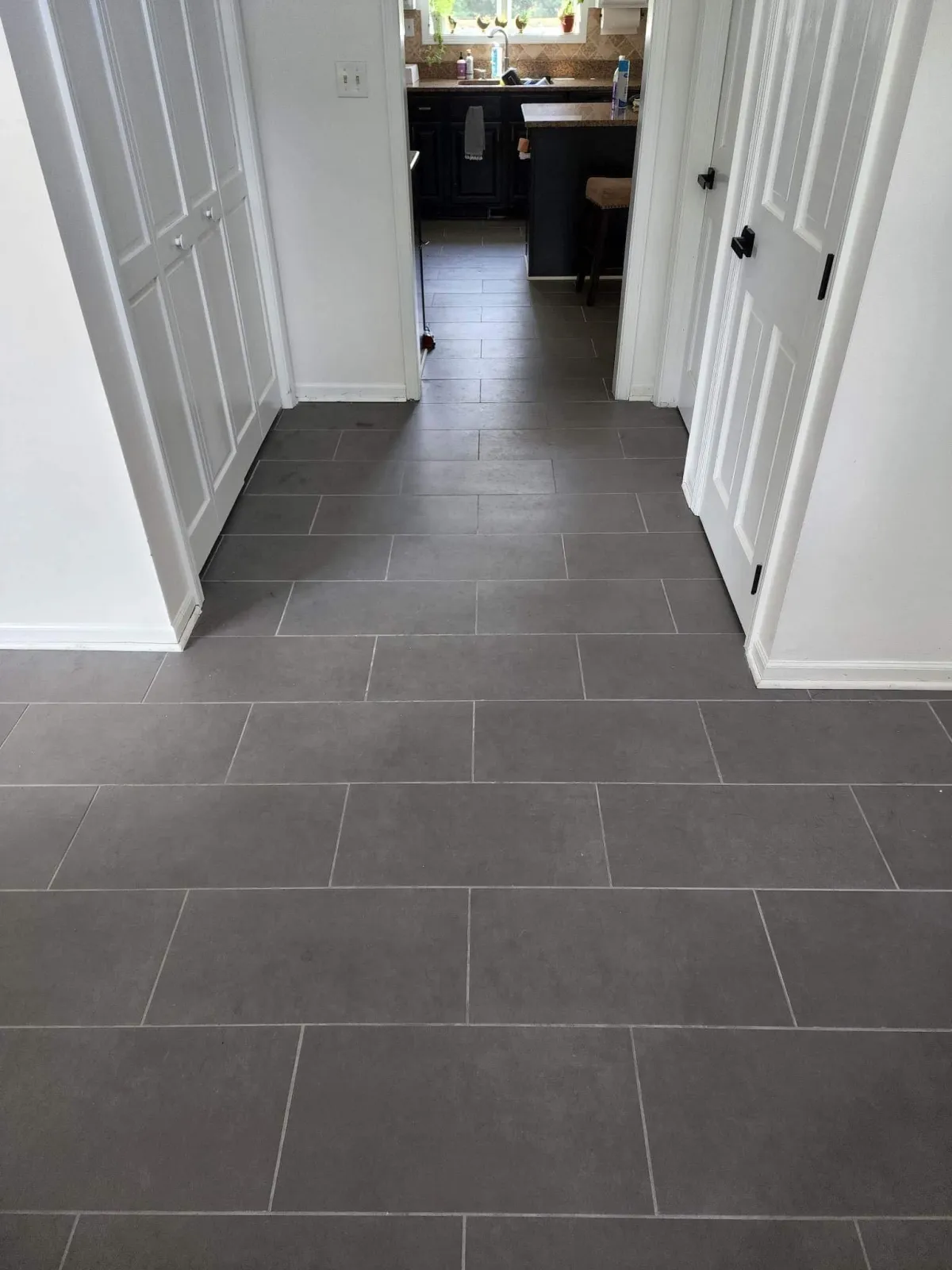 Dark gray tile flooring