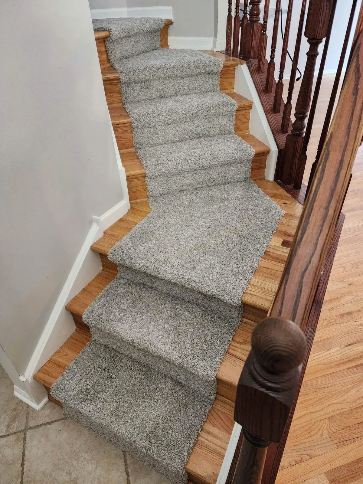 Wooden stairs with carpet in the middle