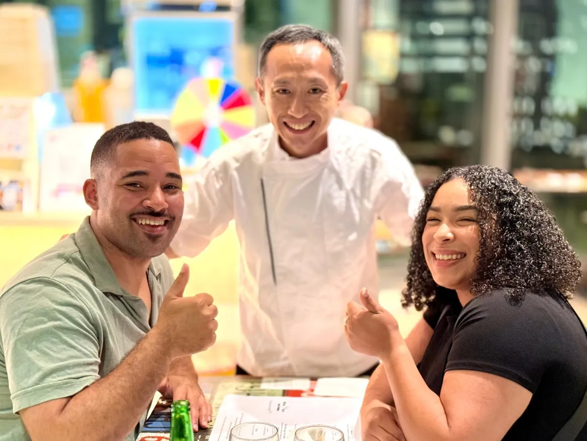 Couple celebrating at a great value French omakase restaurant in Singapore