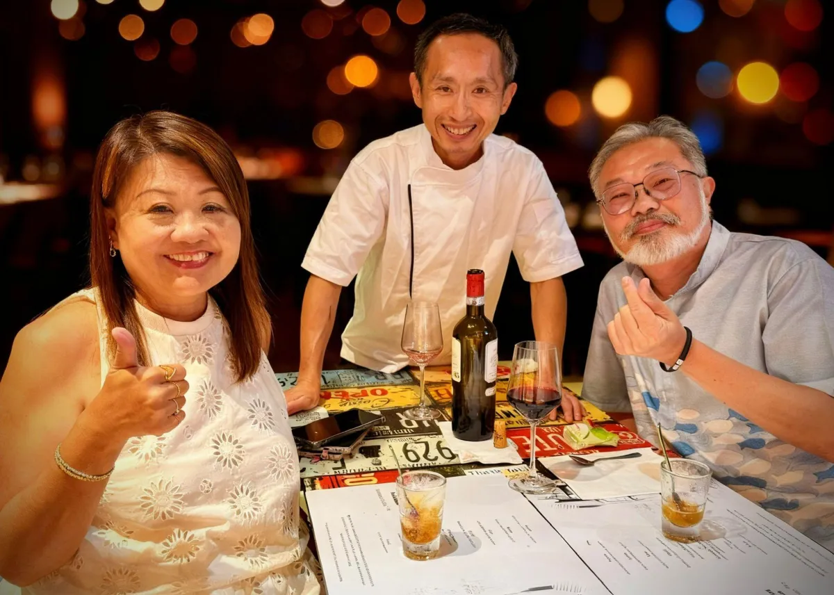 happy Couple clinking glasses at a celebration dinner