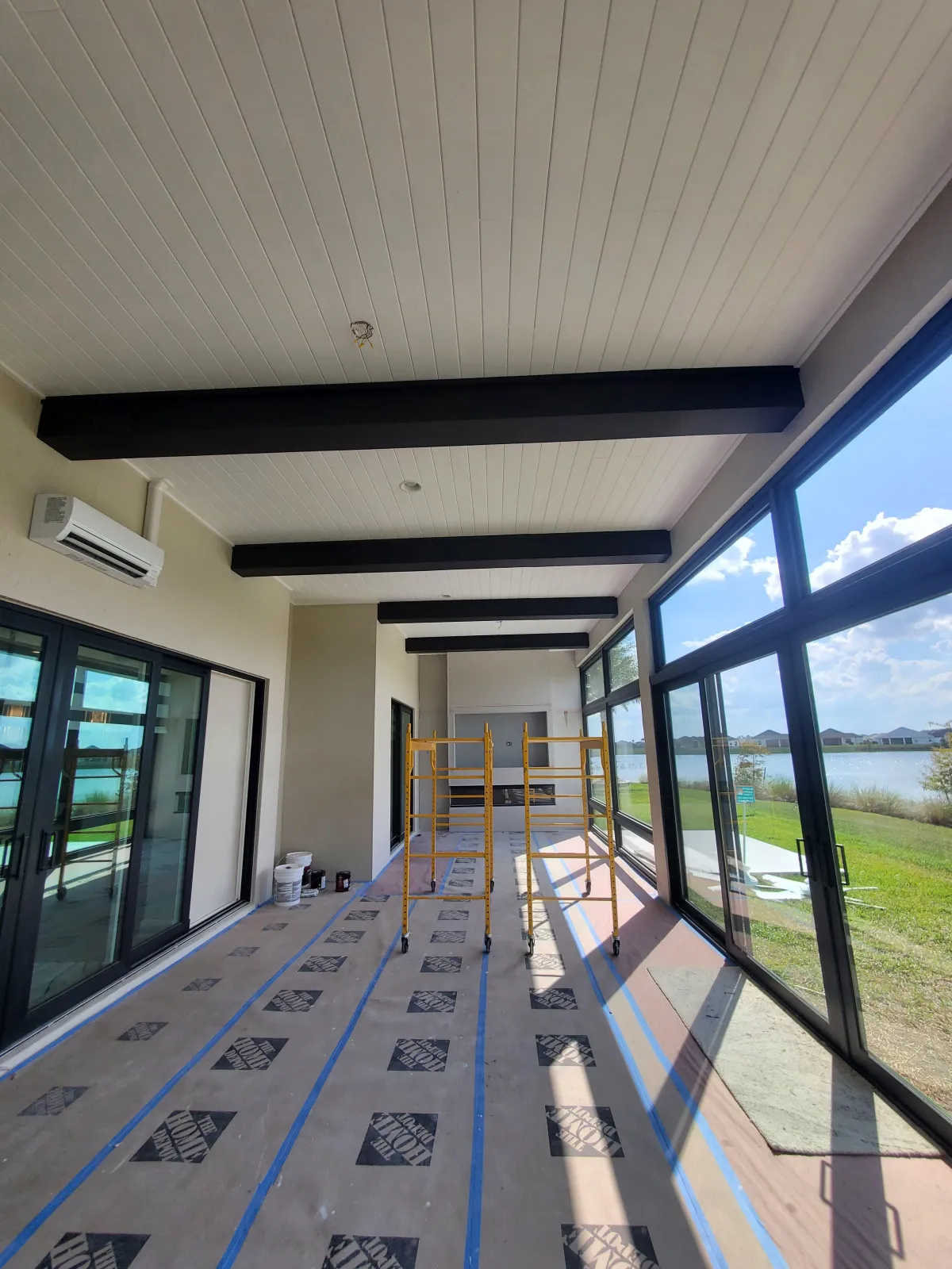 a red fire hydrant sitting next to a yellow hand rail