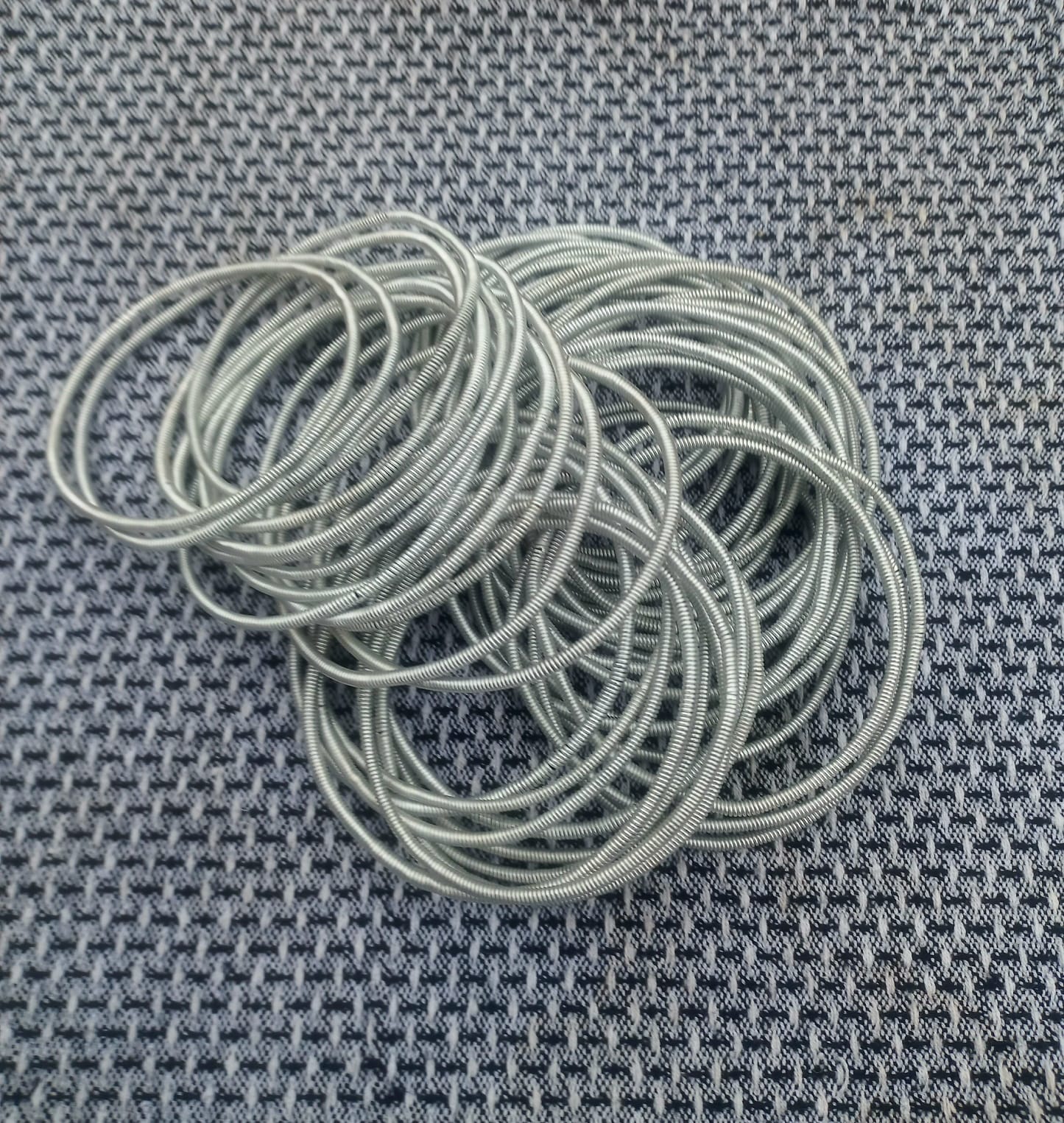 Small neat bundle of Venda bangles for resale testing