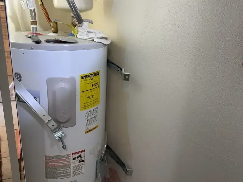 Eastside Repipe And Plumbing technician installing a tankless water heater as part of specialized plumbing services in Bellevue WA