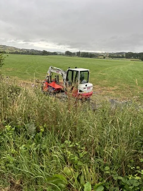 Small digger carrying out improvement work beside Core Path 13 near Kirkcudbright
