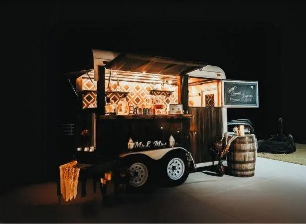 Bar Solo LLC's luxury mobile bar trailer set up for an evening event in Ashtabula County, Ohio, providing mobile bartending services for weddings and parties.