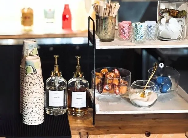 Mobile bartending setup with coffee bar accessories, syrup dispensers, and decorative elements at Bar Solo LLC, a mobile bartending service in Ashtabula County, Ohio.