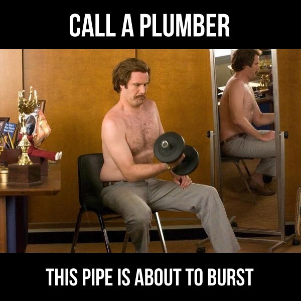 a person wearing a hard hat and holding a hammer