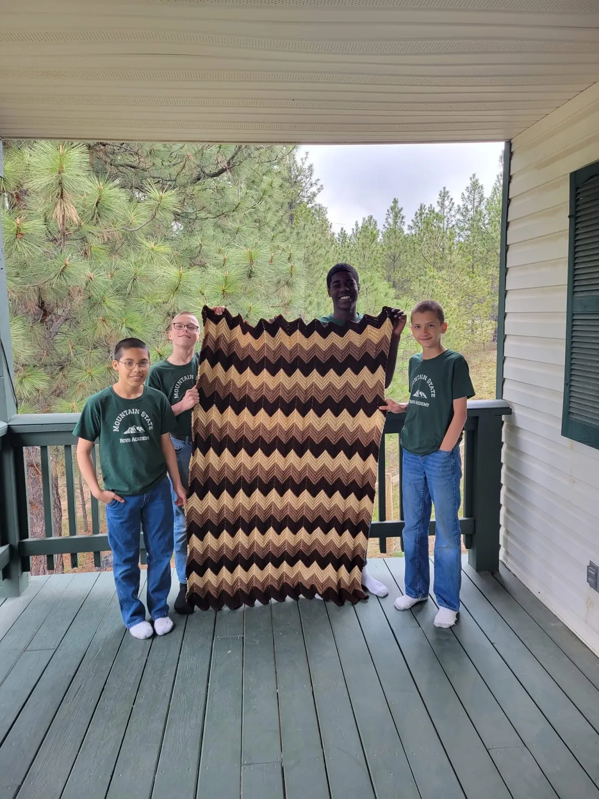 group of childrens sitting on ground