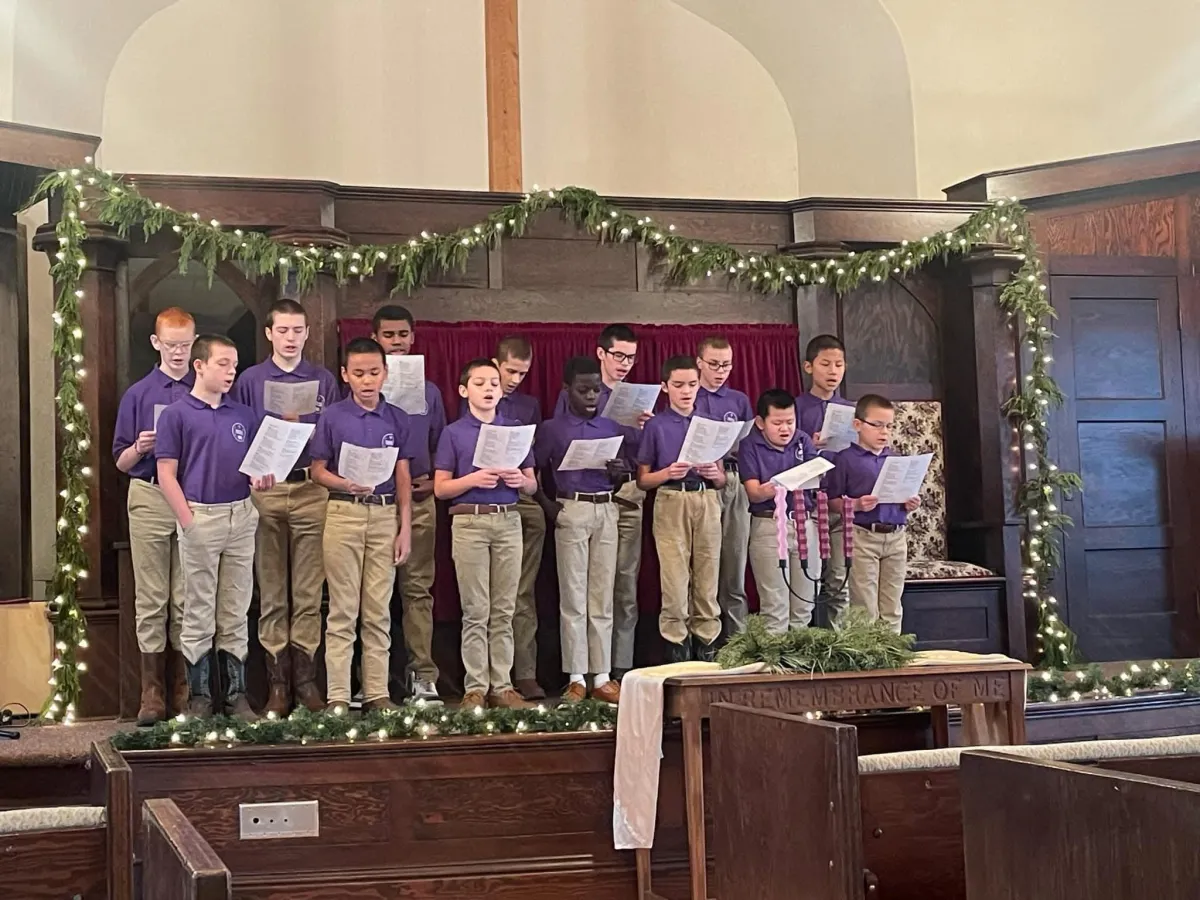 man holding incandescent bulb