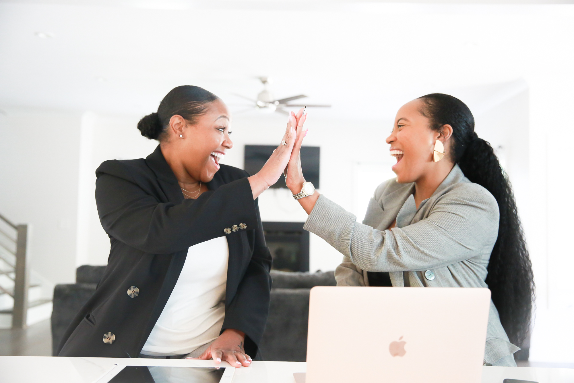 Professional women celebrating career growth and strategic clarity