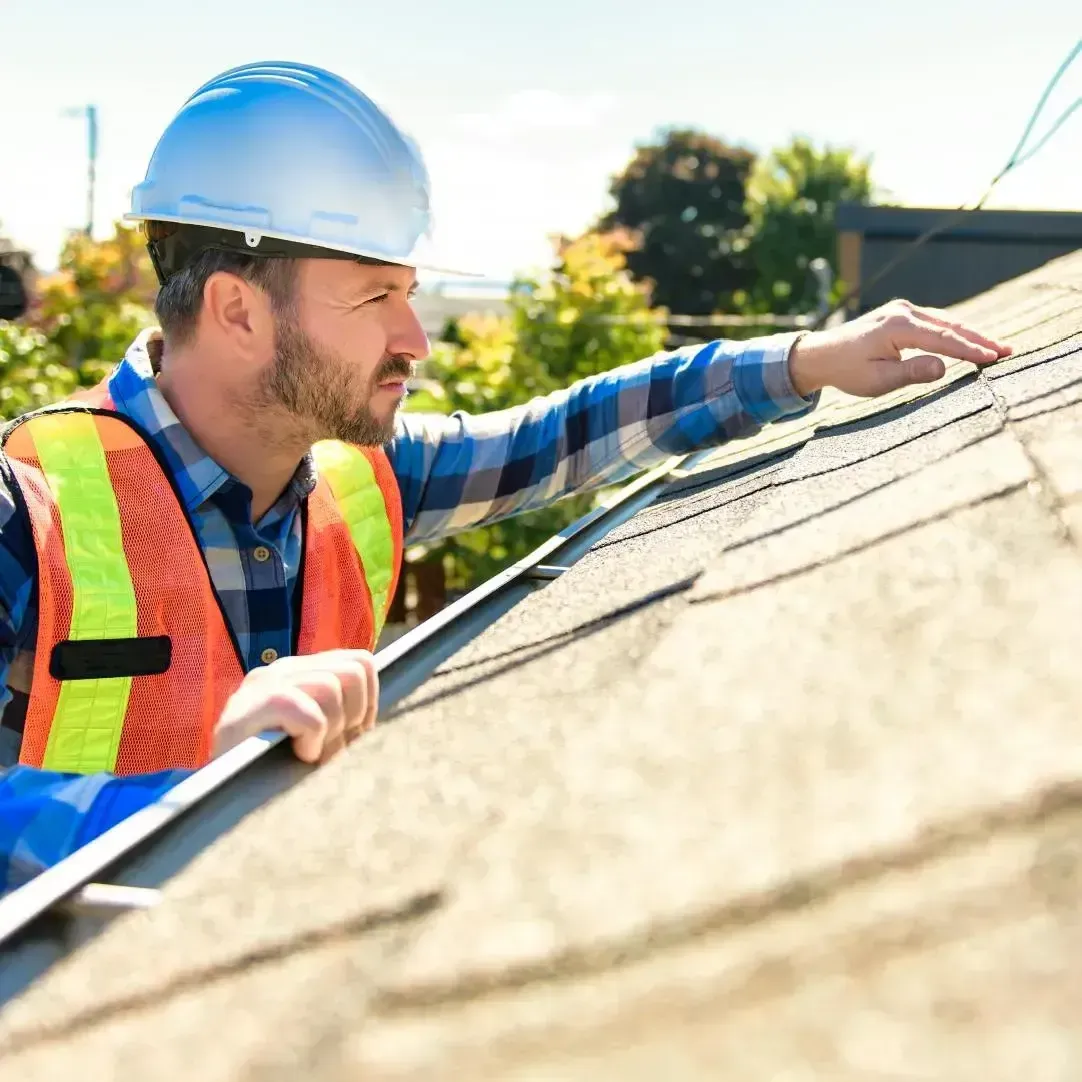 Dunning Roofing contractor performing a professional roof inspection in Central Alabama