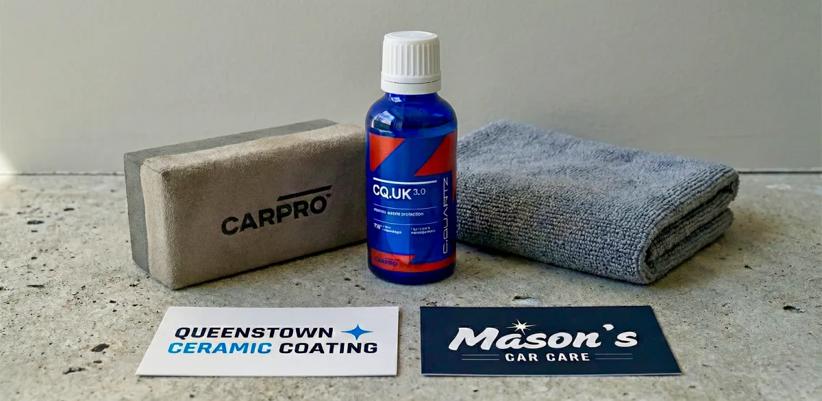 A sleek, white car parked near a building.