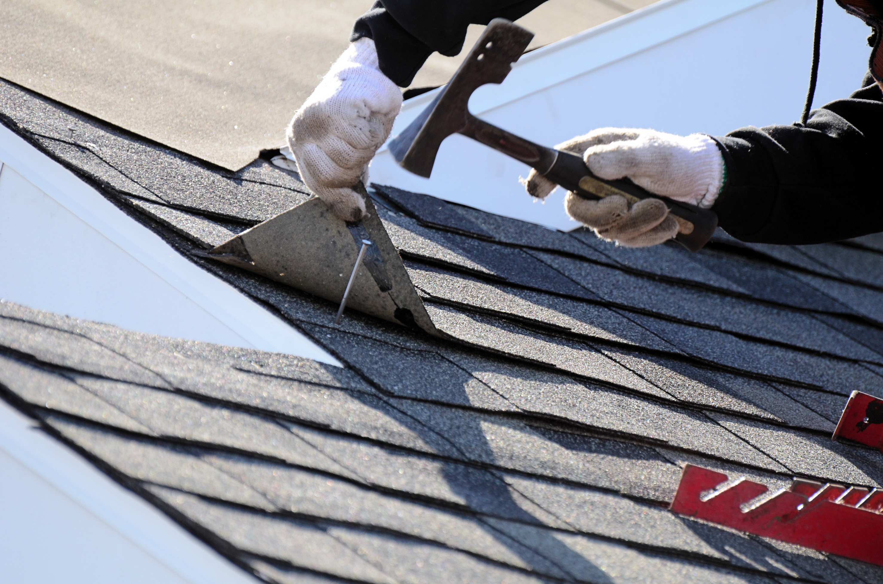 Roofing repair in Huntington Station, NY for a home with visible roof damage