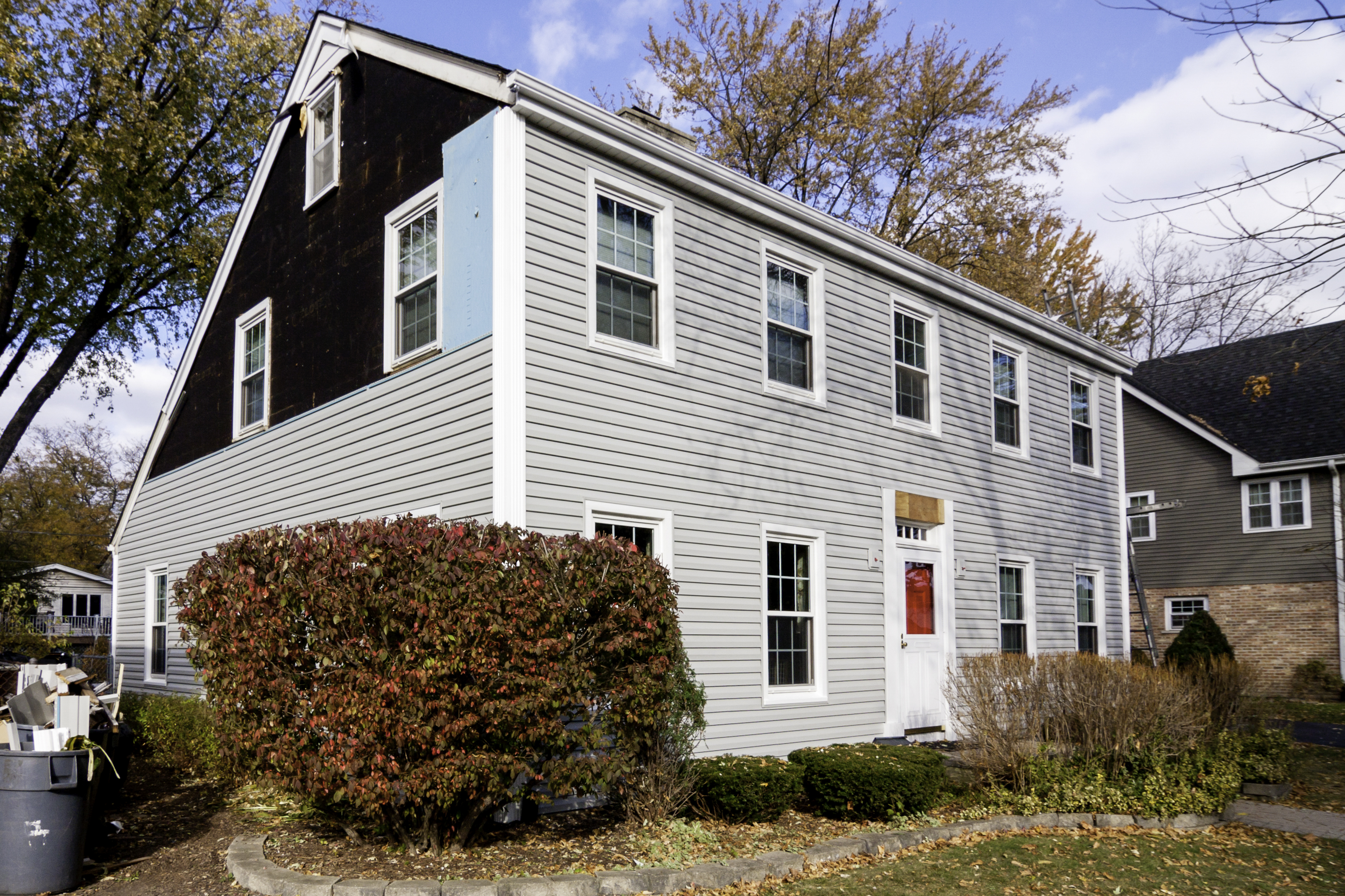 Close view of cracked siding repair on a home in Bay Shore, NY