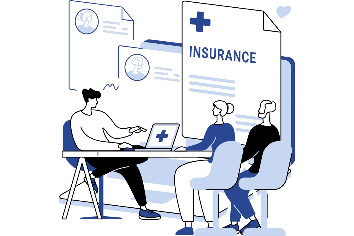 Insurance agent sitting with a couple, reviewing coverage options and reflecting the caring, trustworthy relationships AdviseCare builds with clients.