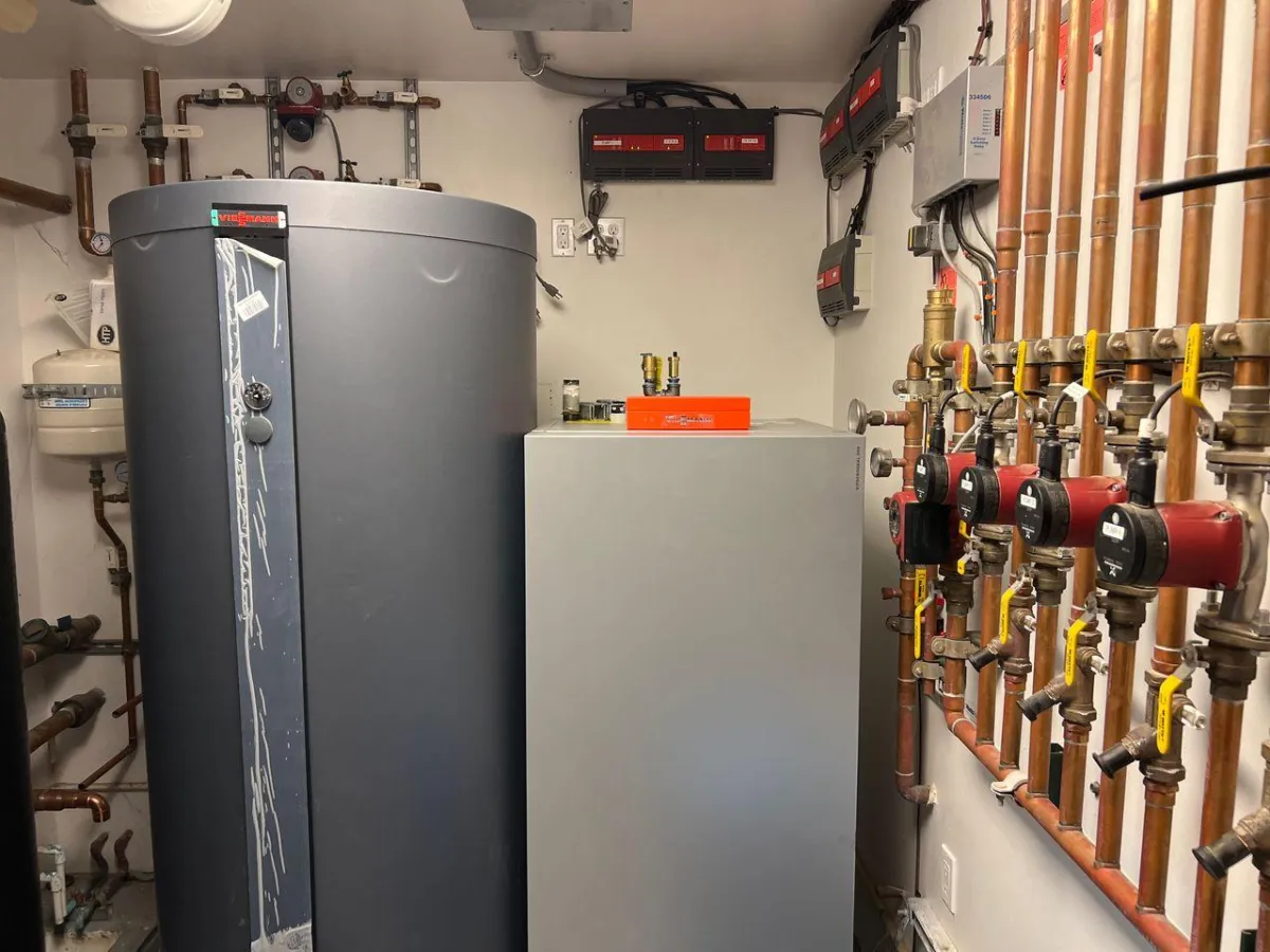 High-efficiency boiler system upgrade with integrated hydronic controls and copper piping, professionally installed to support radiant heating and cooling systems in a Southern California home.