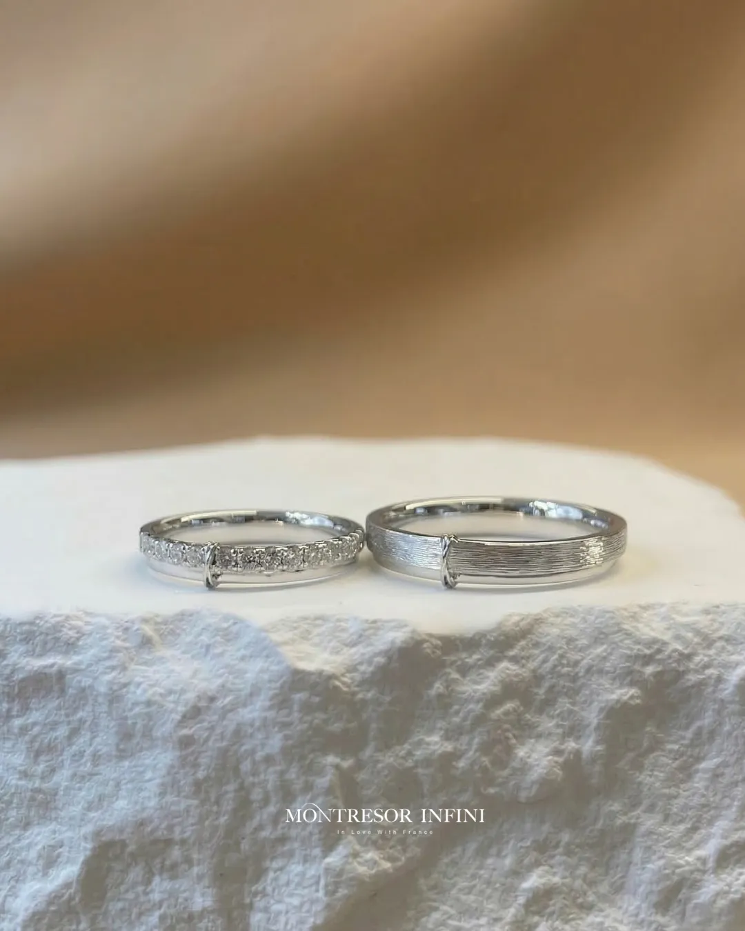 White gold couple wedding bands with pavé diamonds and brushed finish by Montresor Infini.