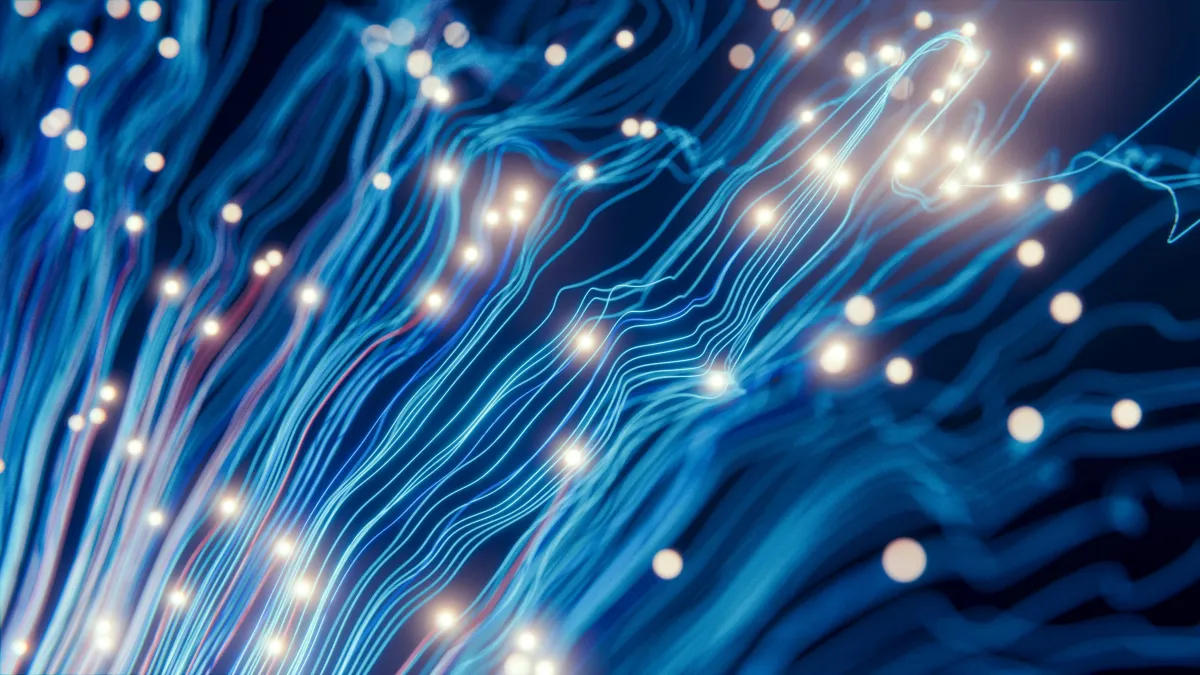 a large display of blue lights in a dark room