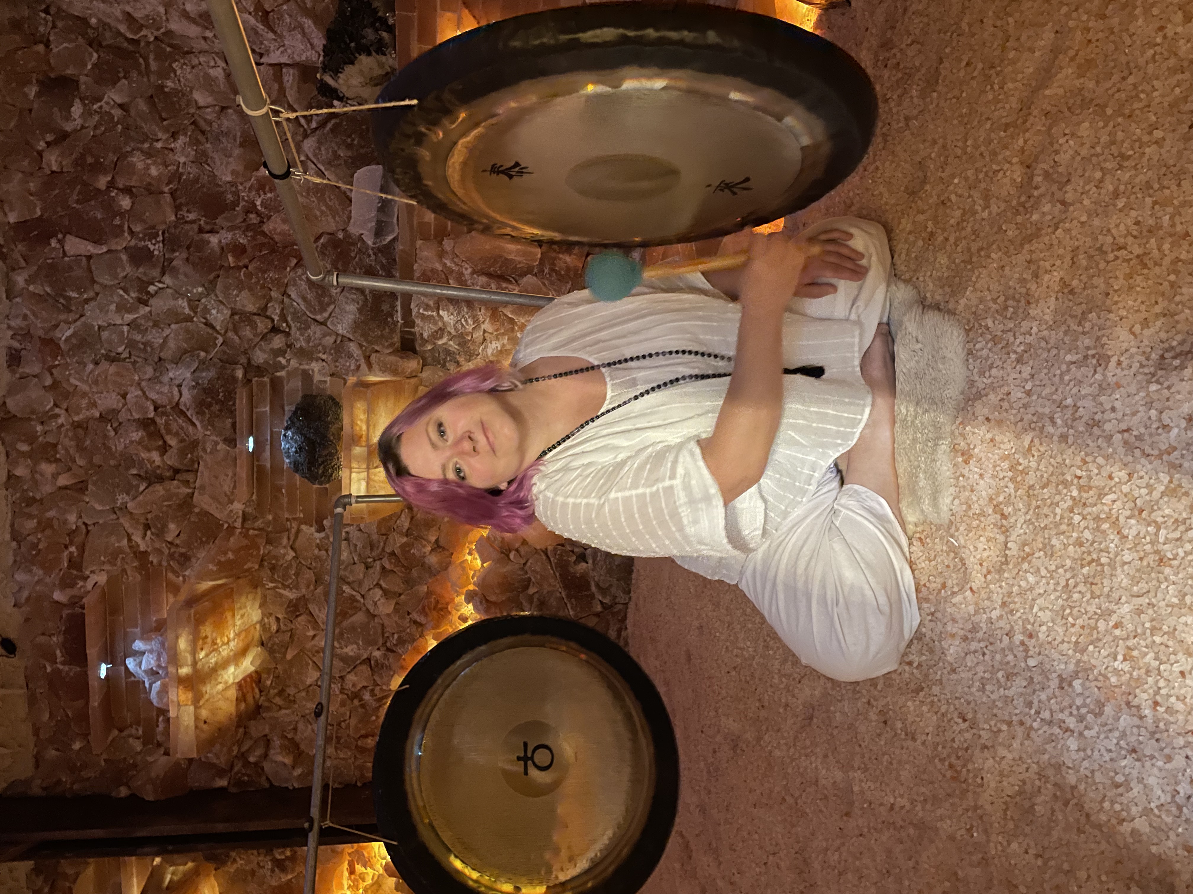 gong with a virgo symbol with the cosmos in the background