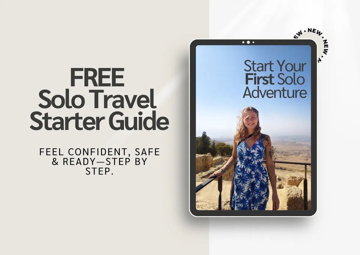 Realistic mockup of the Solo Travel Unlocked eBook guide floating over a golden hour adventure vista