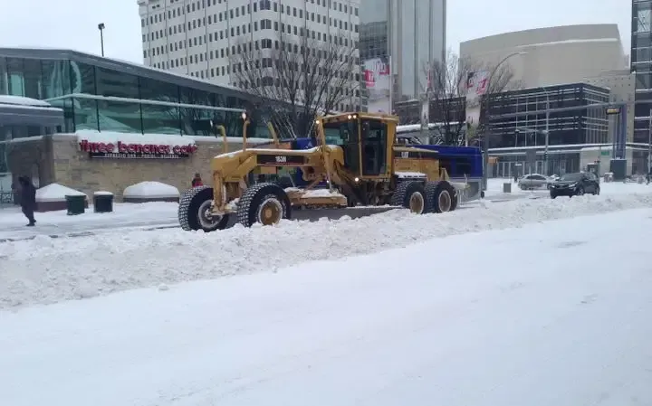 A snow truck clearing Snow on the road of Edmonton Downtown.