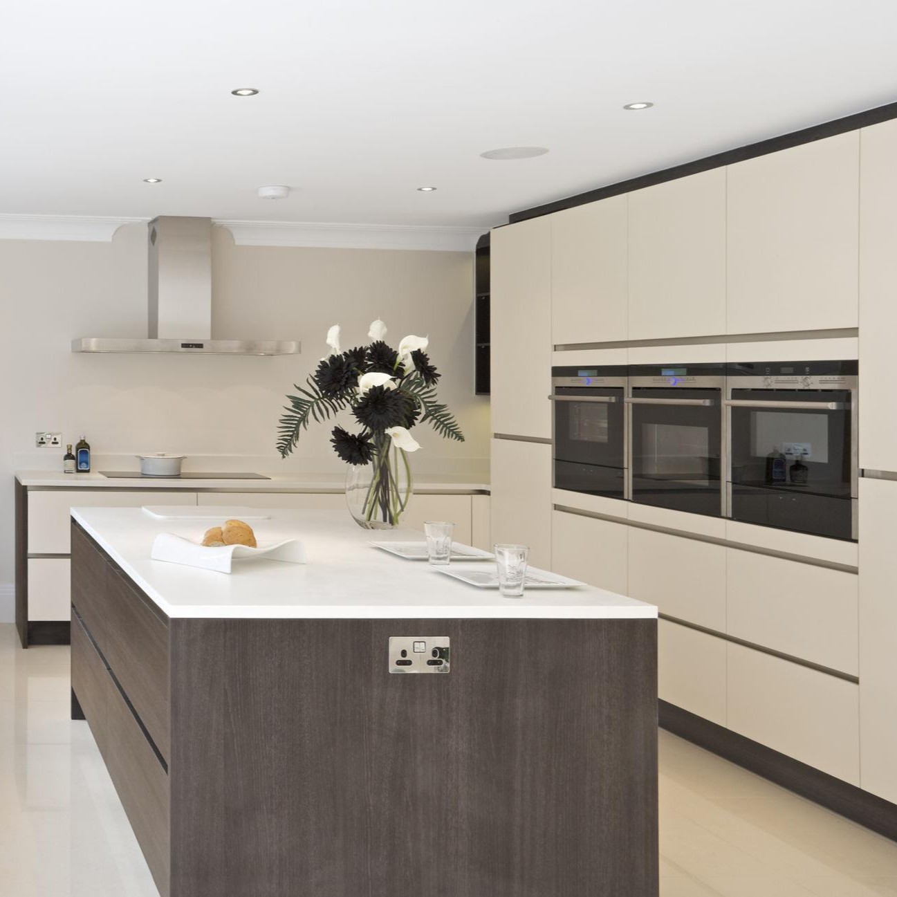 A modern kitchen island with a white countertop and durable surfaces that catch a renter's eye.