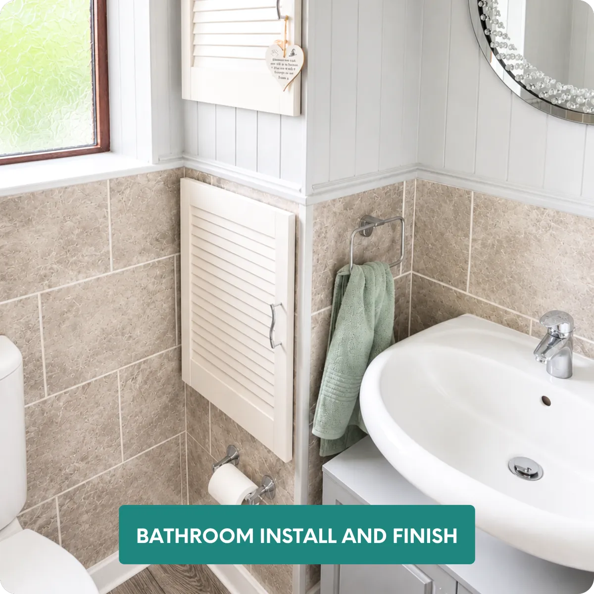 Luxury bathroom renovation with large-format stone-effect tiles and decorative wall panelling 
