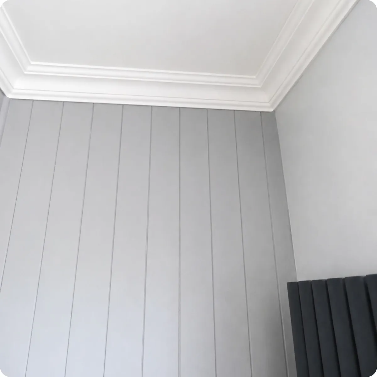 Custom joinery featuring decorative wall panelling and handcrafted coving details 