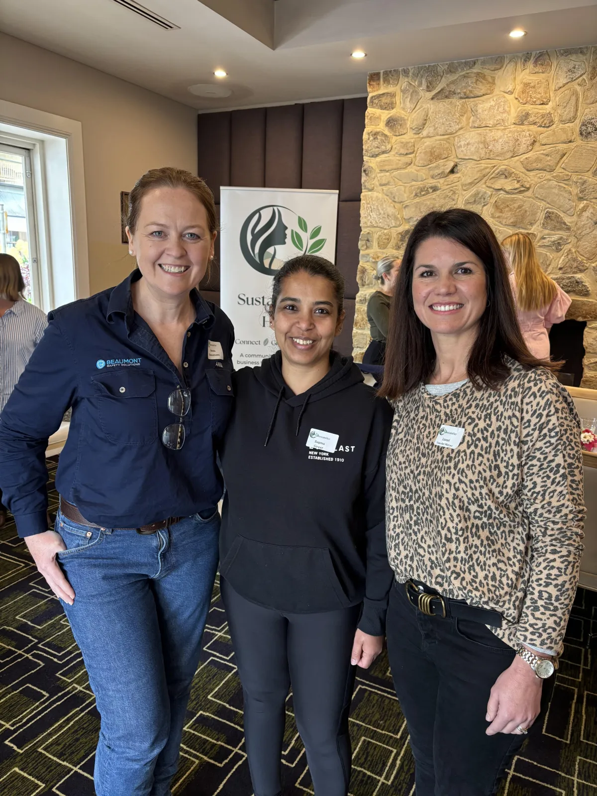 A business consultant offering personalized advice to a small business owner in a cozy office, with charts and a laptop on the table. The consultant is pointing at a growth graph, and both are focused and optimistic.