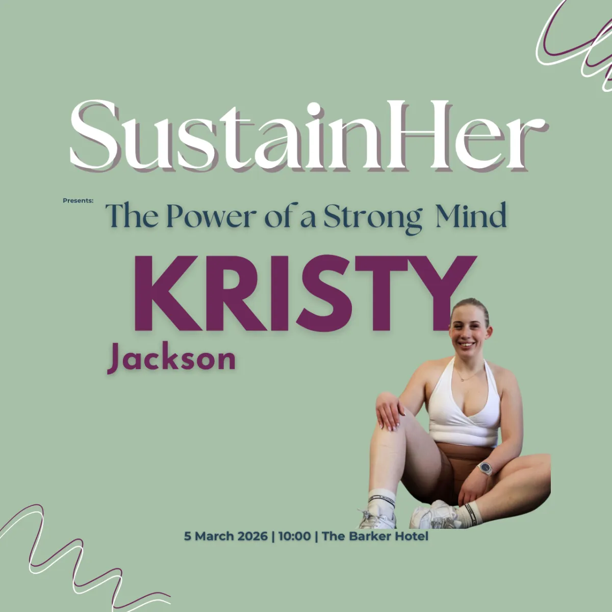 A professional headshot of an Asian woman in a navy suit, standing confidently with arms crossed in a modern office. The background is softly blurred, and her expression is focused and inspiring.