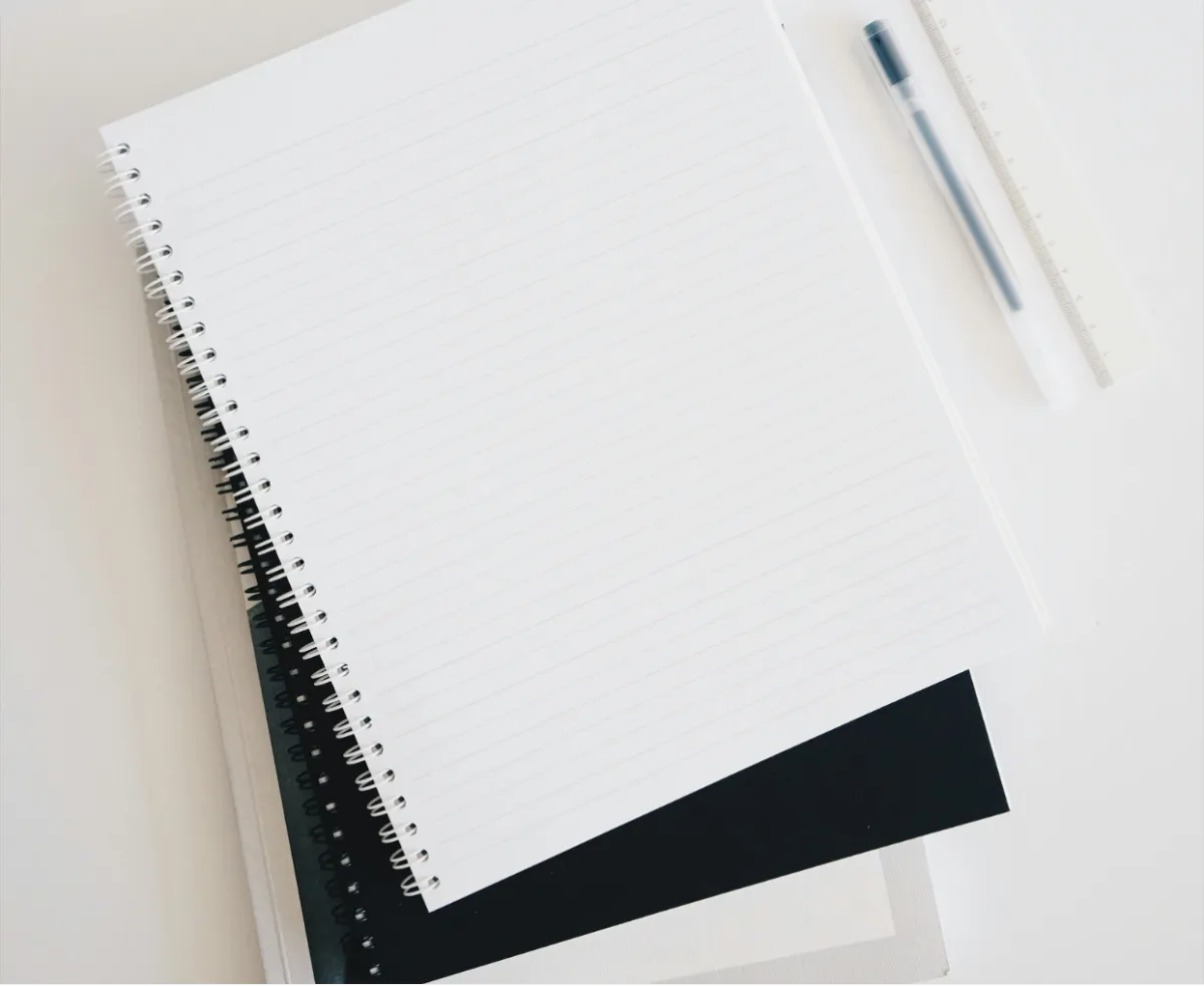 stacked notebooks flatlay