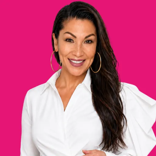 Wanda Lambert, brand messaging strategist for Christian women solopreneurs, smiling in colorful geometric blouse
