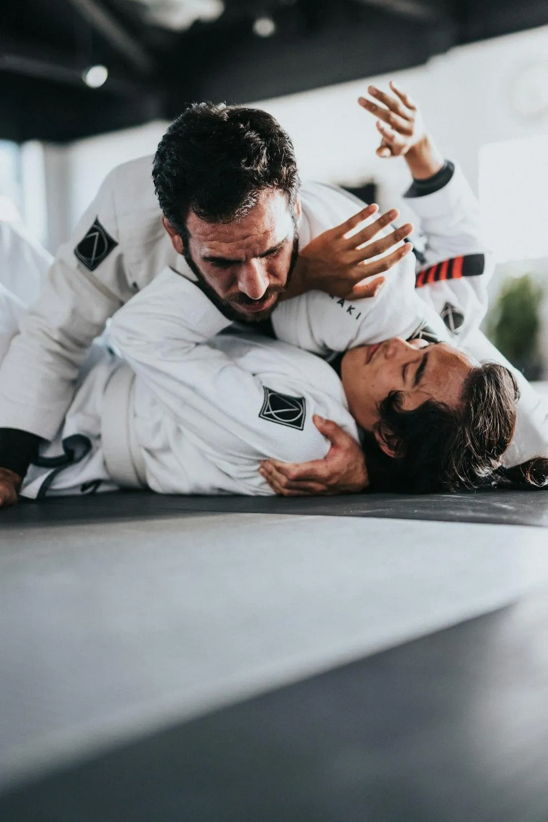 Men working on jiu jitsu, judo, wrestling and self-defense