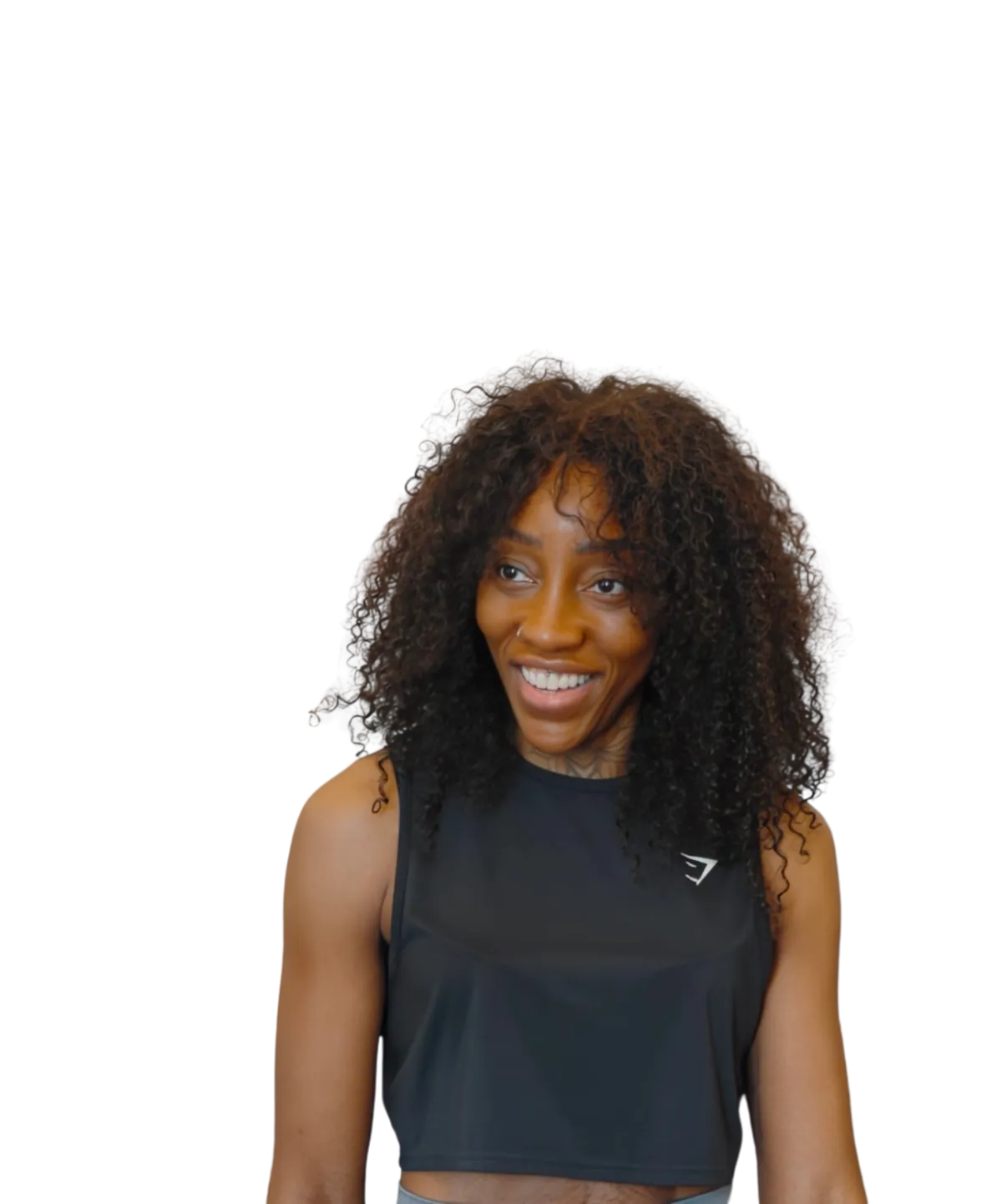 Ursula, strength and fat loss coach for women, standing confidently in workout gear