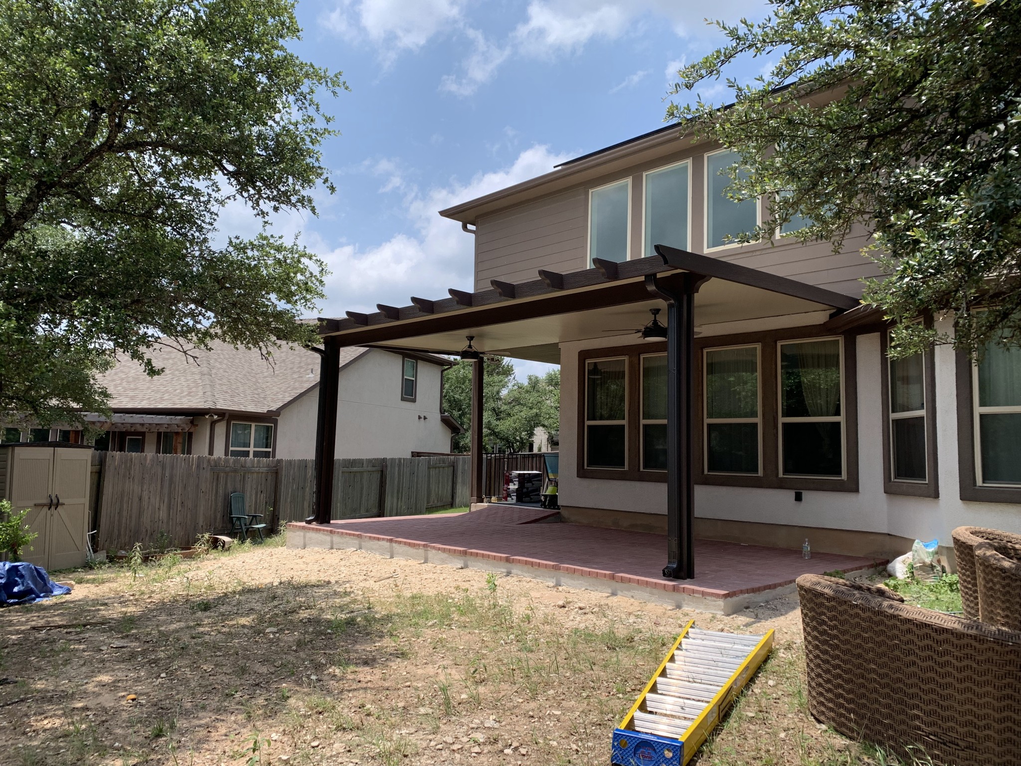 A patio covered in lots of chairs and tables