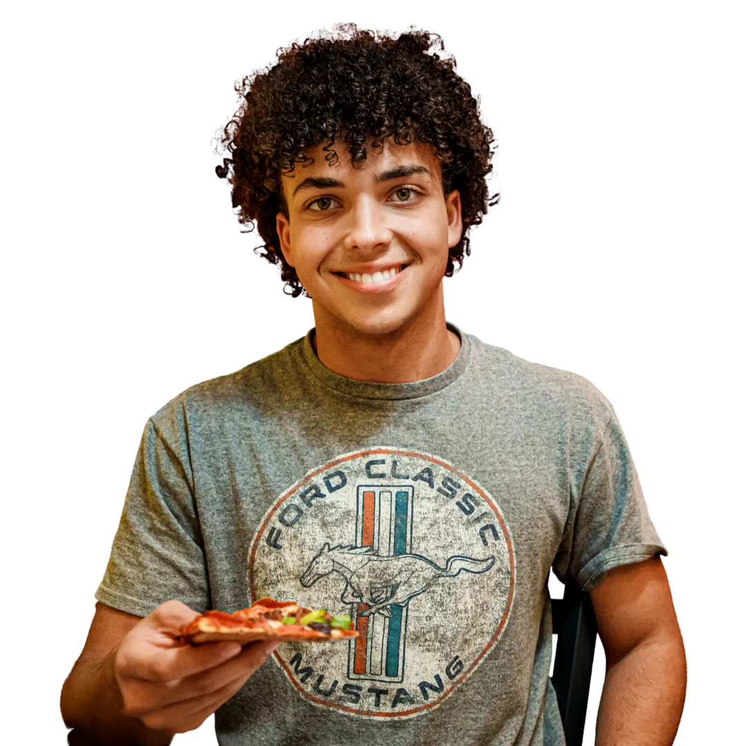 Michael's Pizza & More team member serving pizza