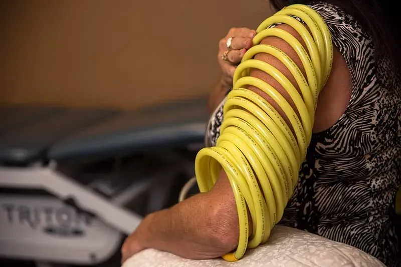 Senior using PEMF comfortably at home