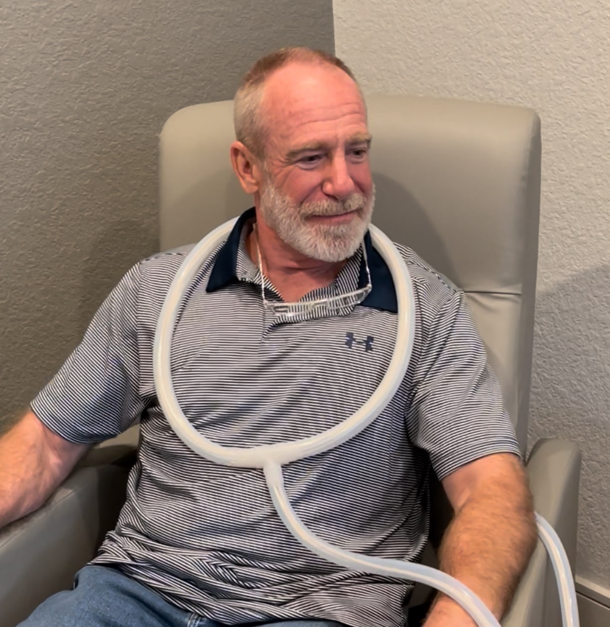Senior using PEMF comfortably at home