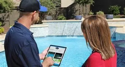 "Pool technician providing follow-up support, guiding the pool owner through a customized maintenance plan for long-term water quality and equipment care."