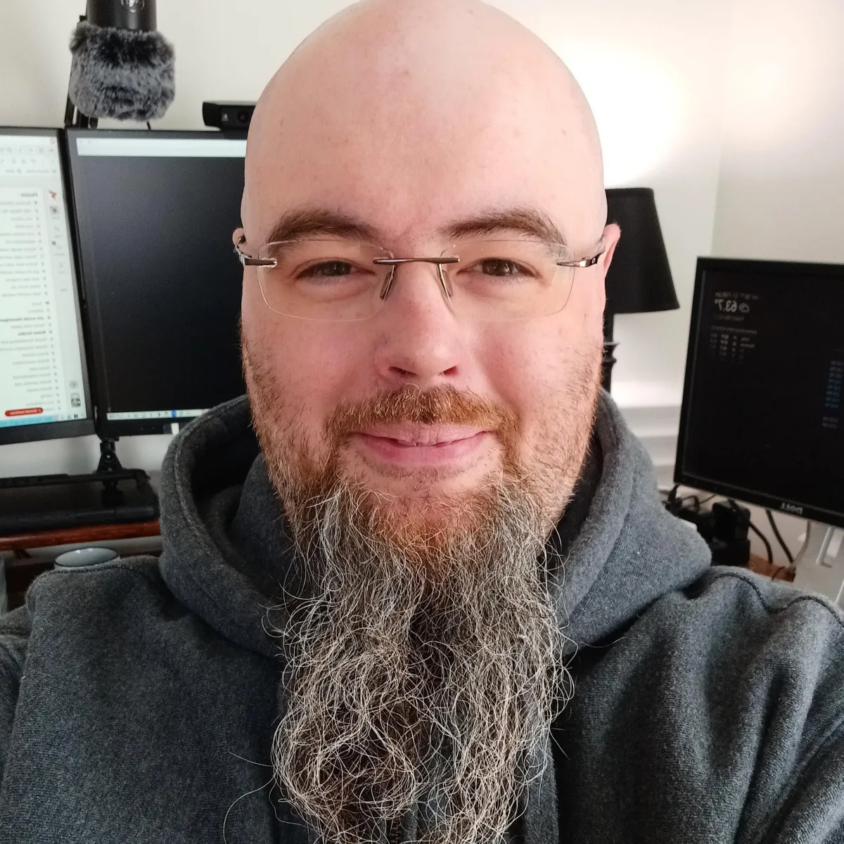 Picture of Wesley (Wes) Dean in front of several monitors