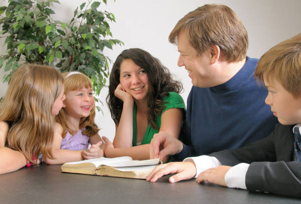 Christian family teaching children to serve others at home through kindness, responsibility, generosity, helping siblings, and living out biblical values of love and humility.