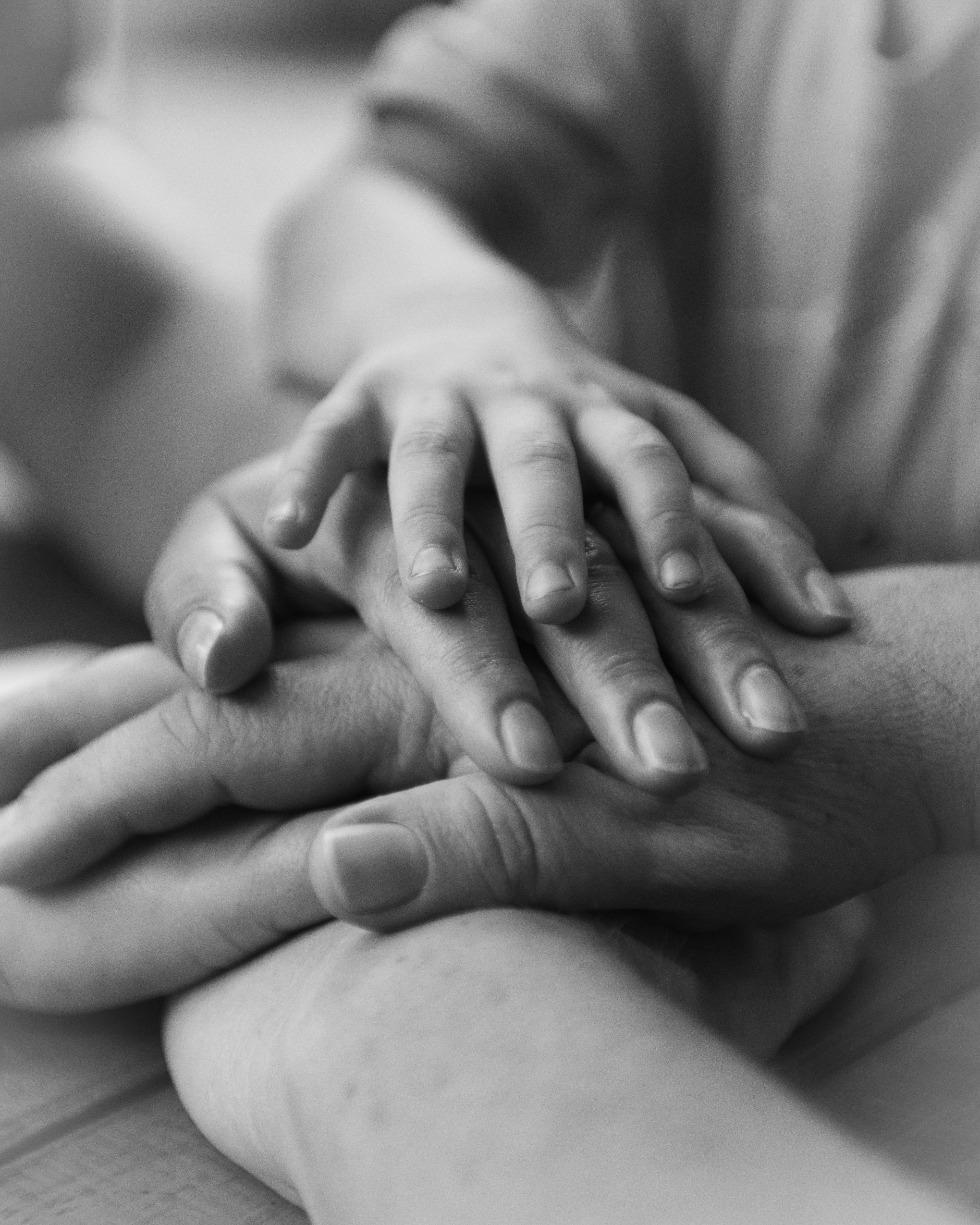 Close-up of a parent gently holding a child's hand, symbolizing emotional support, comfort, trust, family love, and emotional safety in the home.