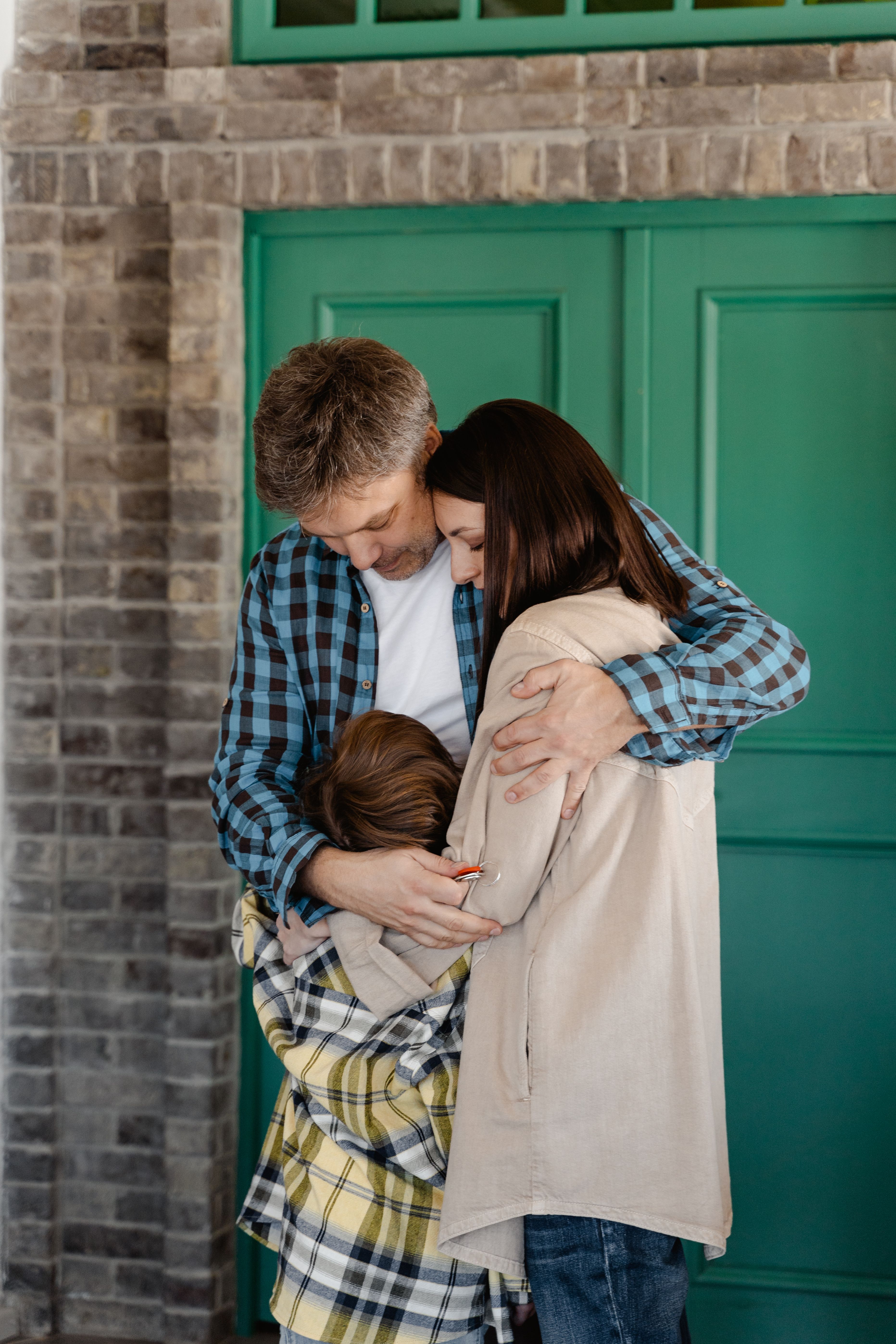 Parents Comforting Their Child With Love and Reassurance, Creating a Safe and Supportive Family Environment to Help Children Cope With Fear and Anxiety.