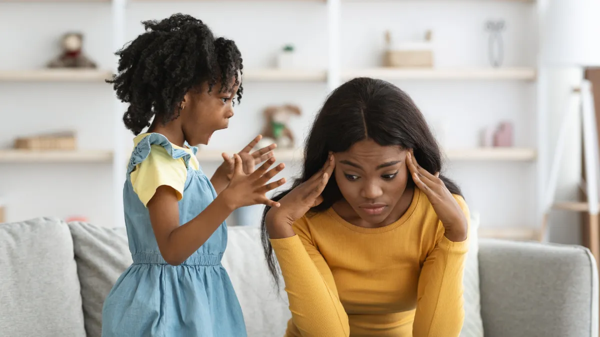 woman placing sticky notes on wall